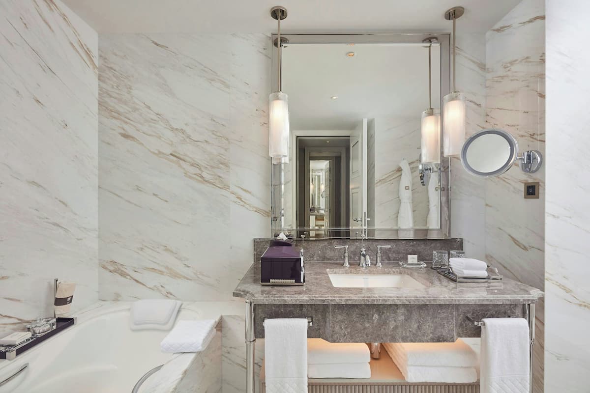 separate bathtub and shower, deep-soaking bathtub, designer toiletries