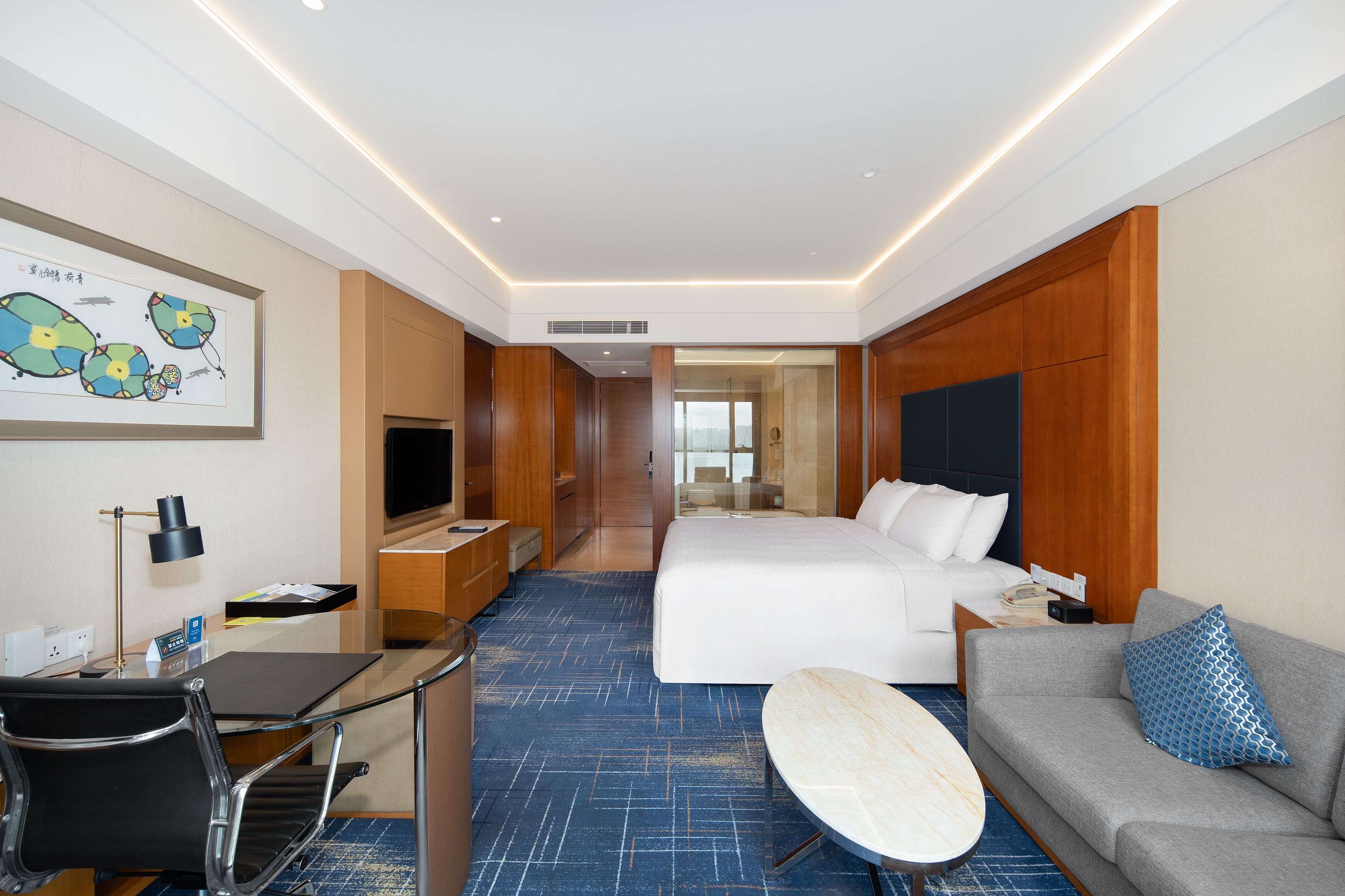 premium room, 1 king bed, partial lake view | minibar, in-room safe, individually furnished, desk