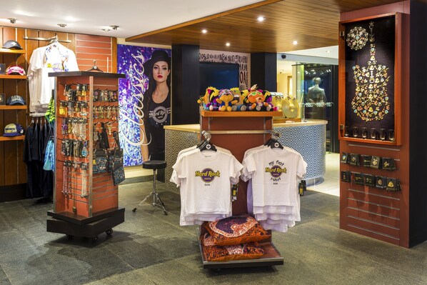 A Hard Rock Hotel Goa store with merchandise displays, including t-shirts, bags, and keychains. - Hard Rock Hotel Goa Calangute (Calangute)