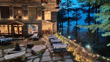 Breakfast, lunch, dinner served; Indian cuisine, garden views