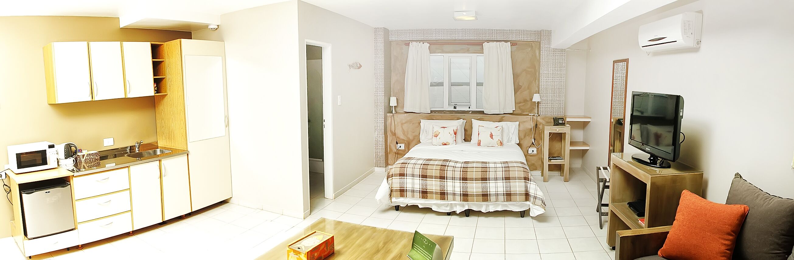 classic room, kitchenette, river view | down duvets, pillow-top beds, in-room safe, individually decorated