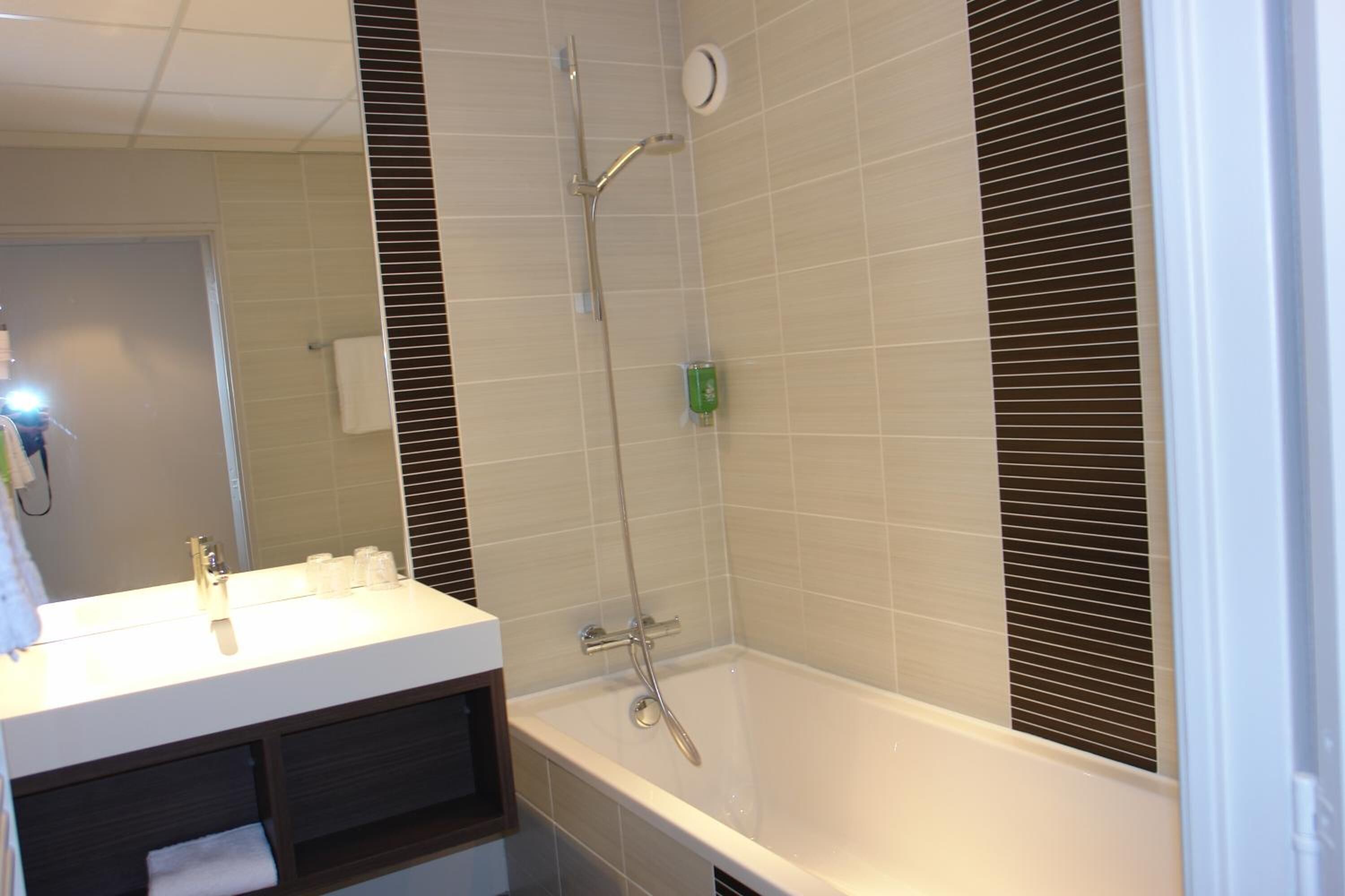 rainfall showerhead, eco-friendly toiletries, hair dryer, towels