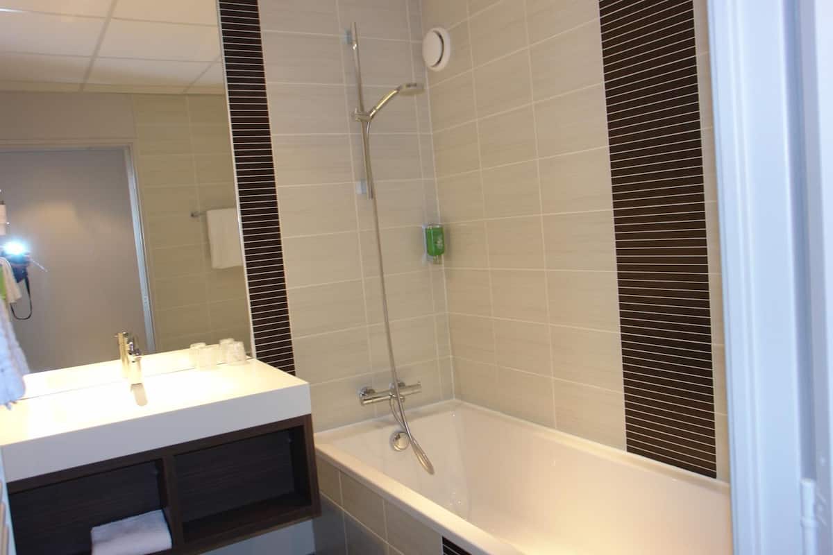 rainfall showerhead, eco-friendly toiletries, hair dryer, towels