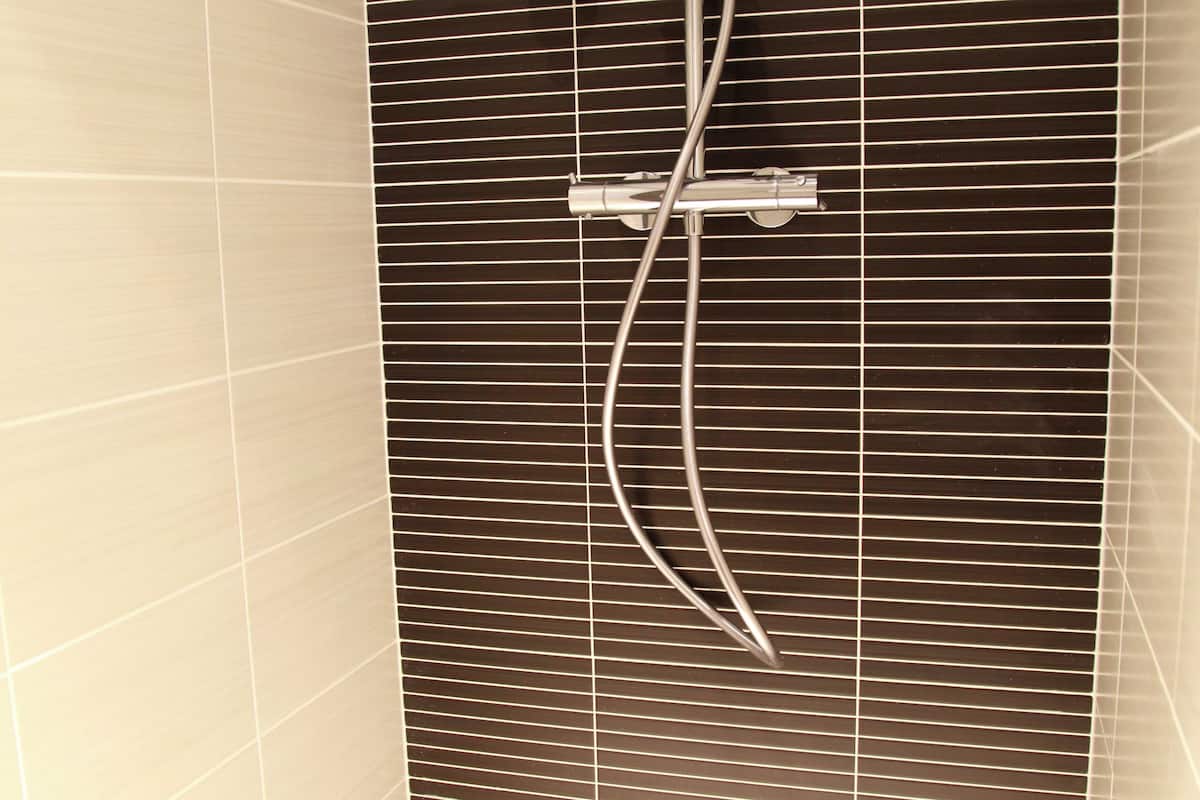 rainfall showerhead, eco-friendly toiletries, hair dryer, towels