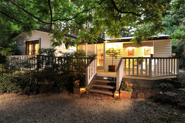 Deluxe Cottage, 2 Queen Beds, Garden View | Front of property – evening/night