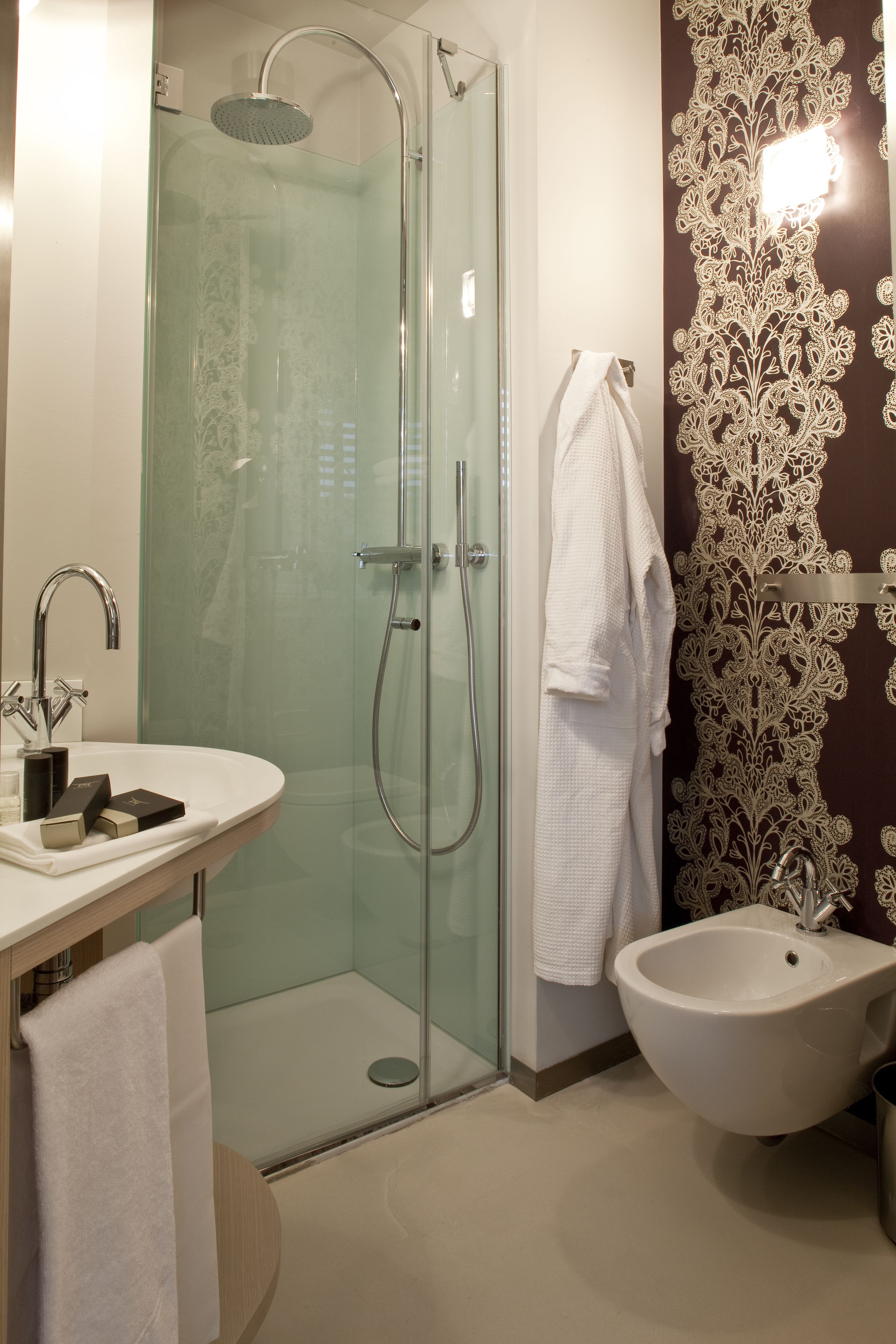 designer toiletries, hair dryer, dressing gowns, slippers