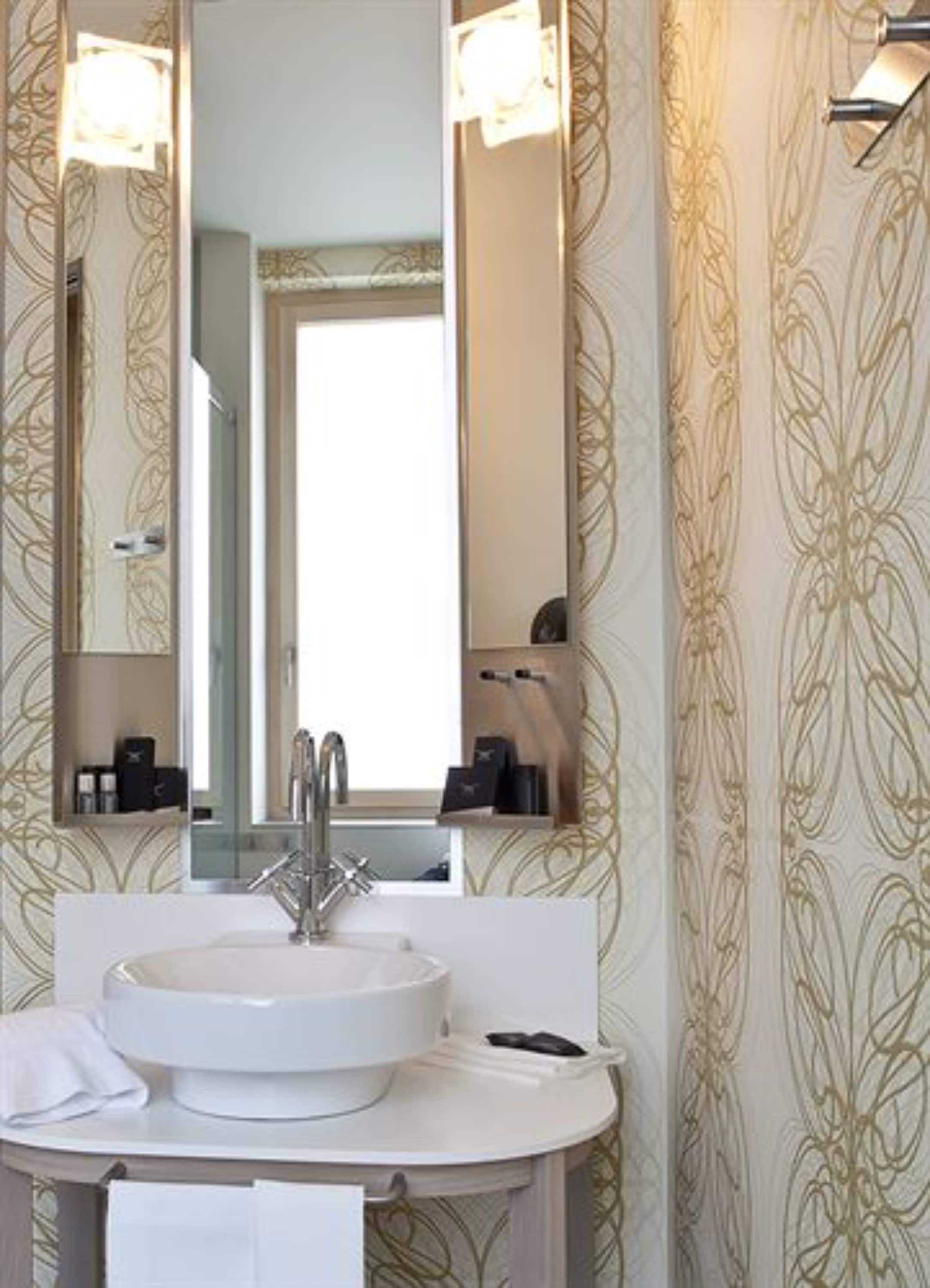 designer toiletries, hair dryer, dressing gowns, slippers