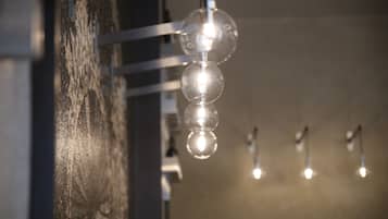A close-up of a hanging light fixture with multiple bulbs.