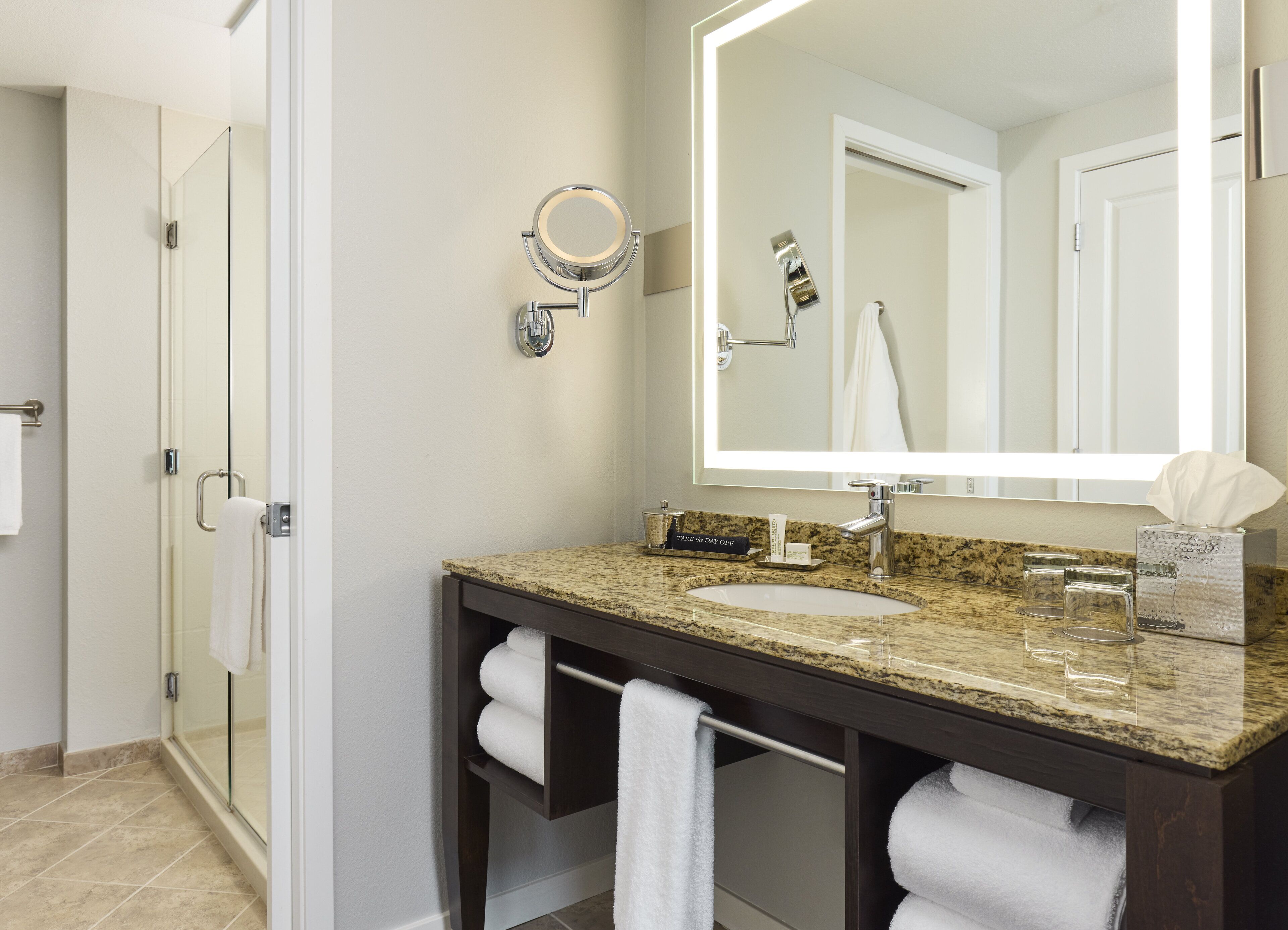 designer toiletries, hair dryer, bathrobes, slippers