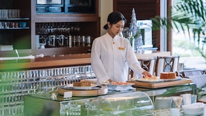 A buffet setup with various food items and a bar area in the background. - The Terrace Club Wellness Thalasso At Busena (Nago)