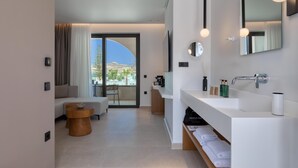 A modern bathroom with a large mirror, two sinks, and a shower area. - Dore Hotel (Chania)