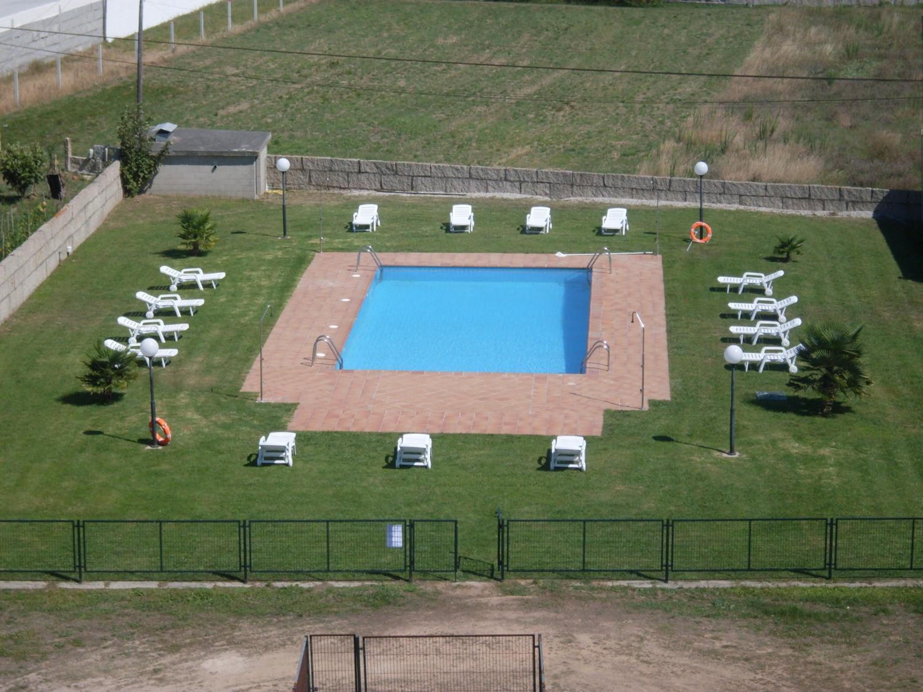 seasonal outdoor pool, pool umbrellas, pool loungers