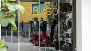 A storefront with the word "TOBAGO" displayed prominently. - Tobago Hotel (Garda)