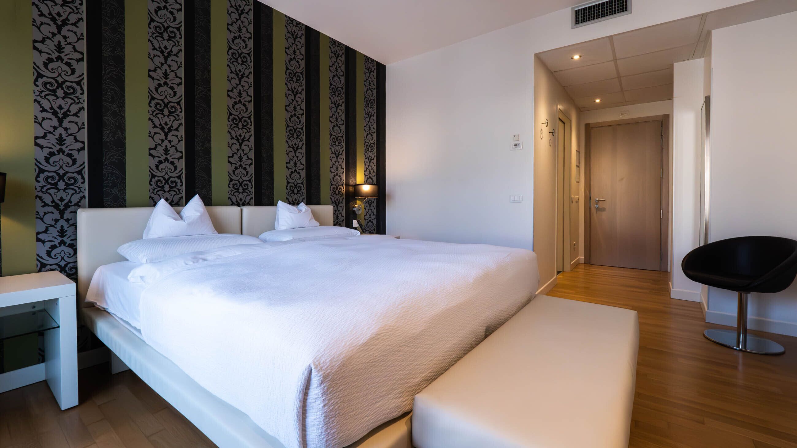 Room IN | Down duvets, pillow-top beds, minibar, in-room safe