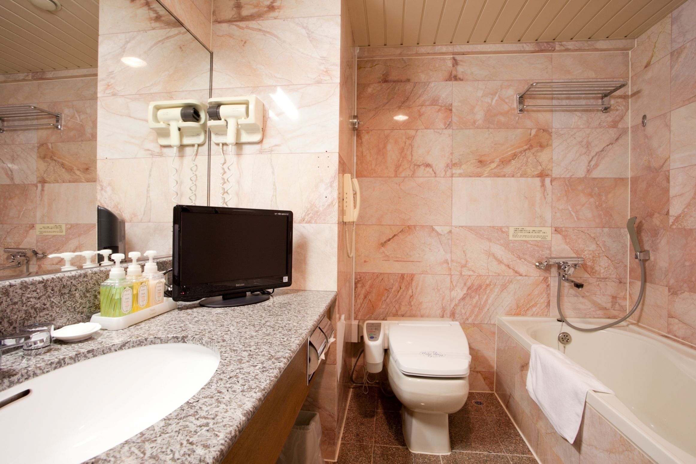 separate bathtub and shower, free toiletries, hair dryer, slippers