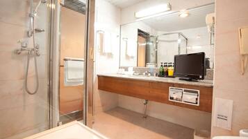 Separate bathtub and shower, free toiletries, hair dryer, slippers