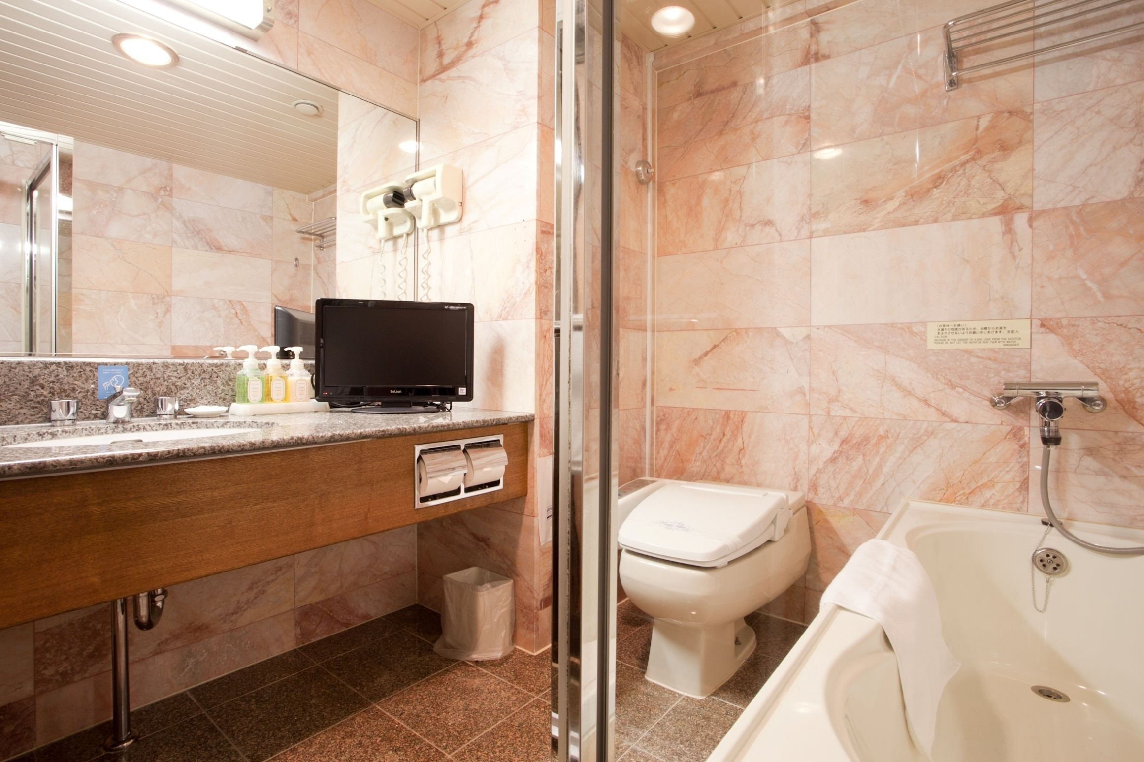 separate bathtub and shower, free toiletries, hair dryer, slippers