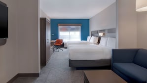 A hotel room with a large bed, a sofa, a TV, and a desk. - Holiday Inn Express Hotel & Suites Prattville South by IHG (Prattville)