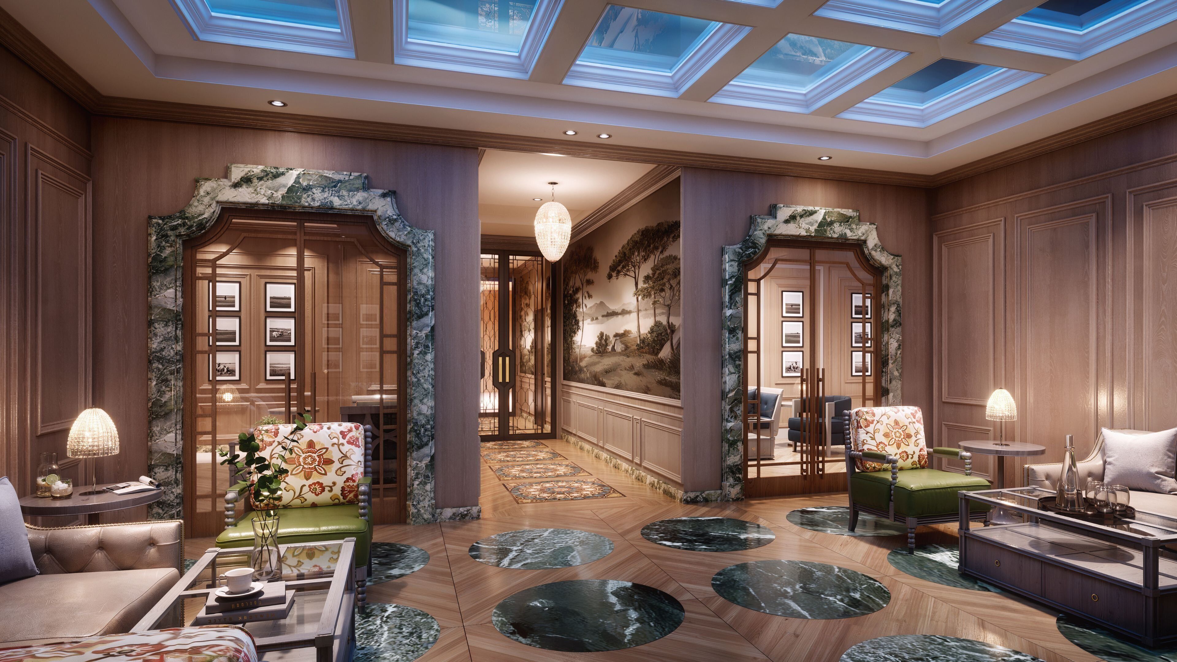 Un lobby de hotel lujoso con una imponente escalera, pisos de mármol y muebles elegantes.