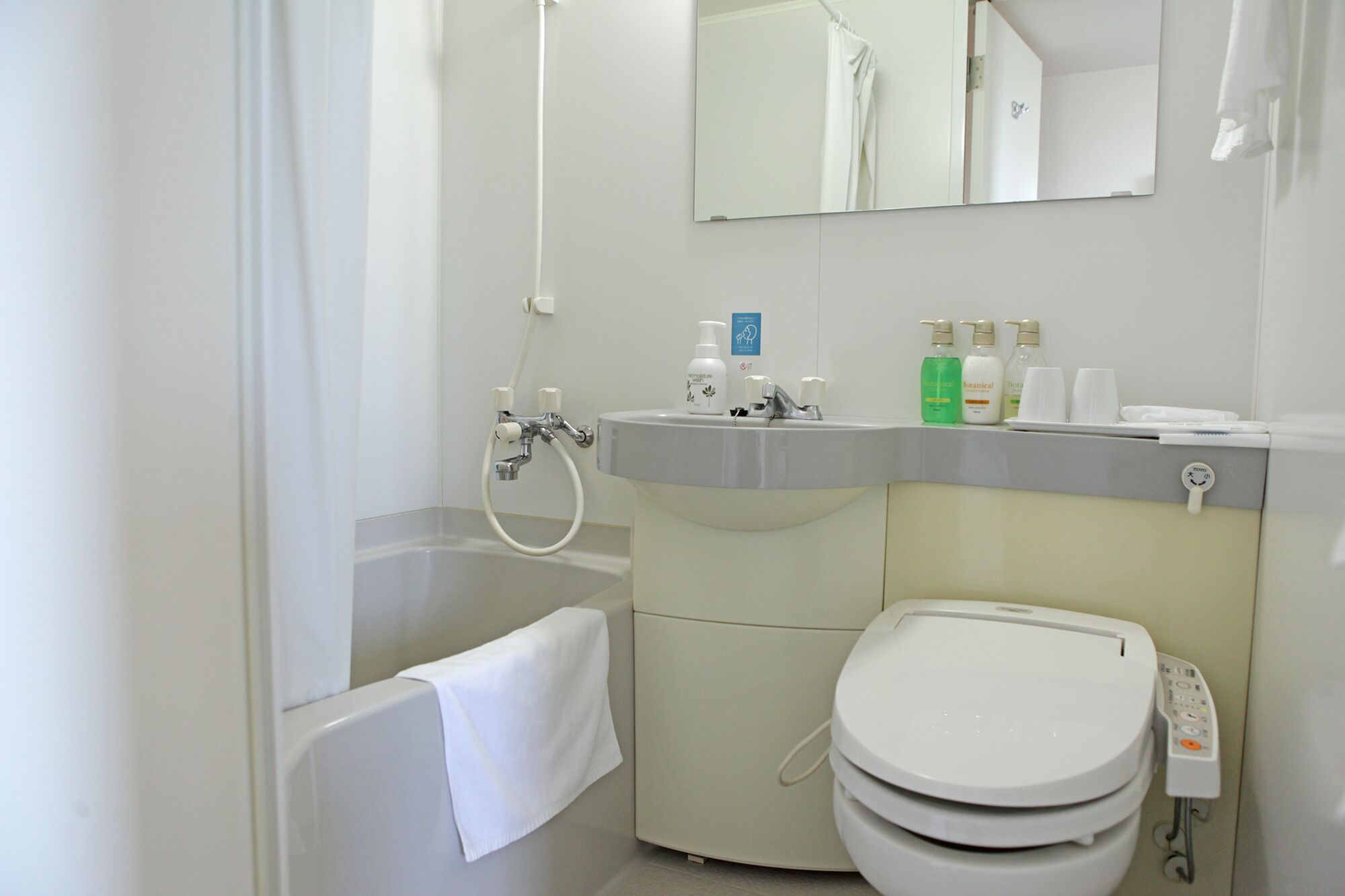 combined shower/bathtub, free toiletries, hair dryer, slippers