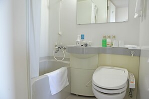 Combined shower/tub, free toiletries, hair dryer, slippers