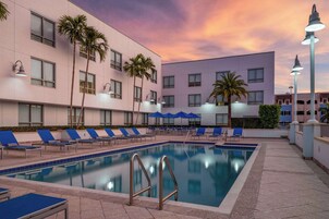 Outdoor pool, open 6:00 AM to 10:00 PM, pool umbrellas, sun loungers