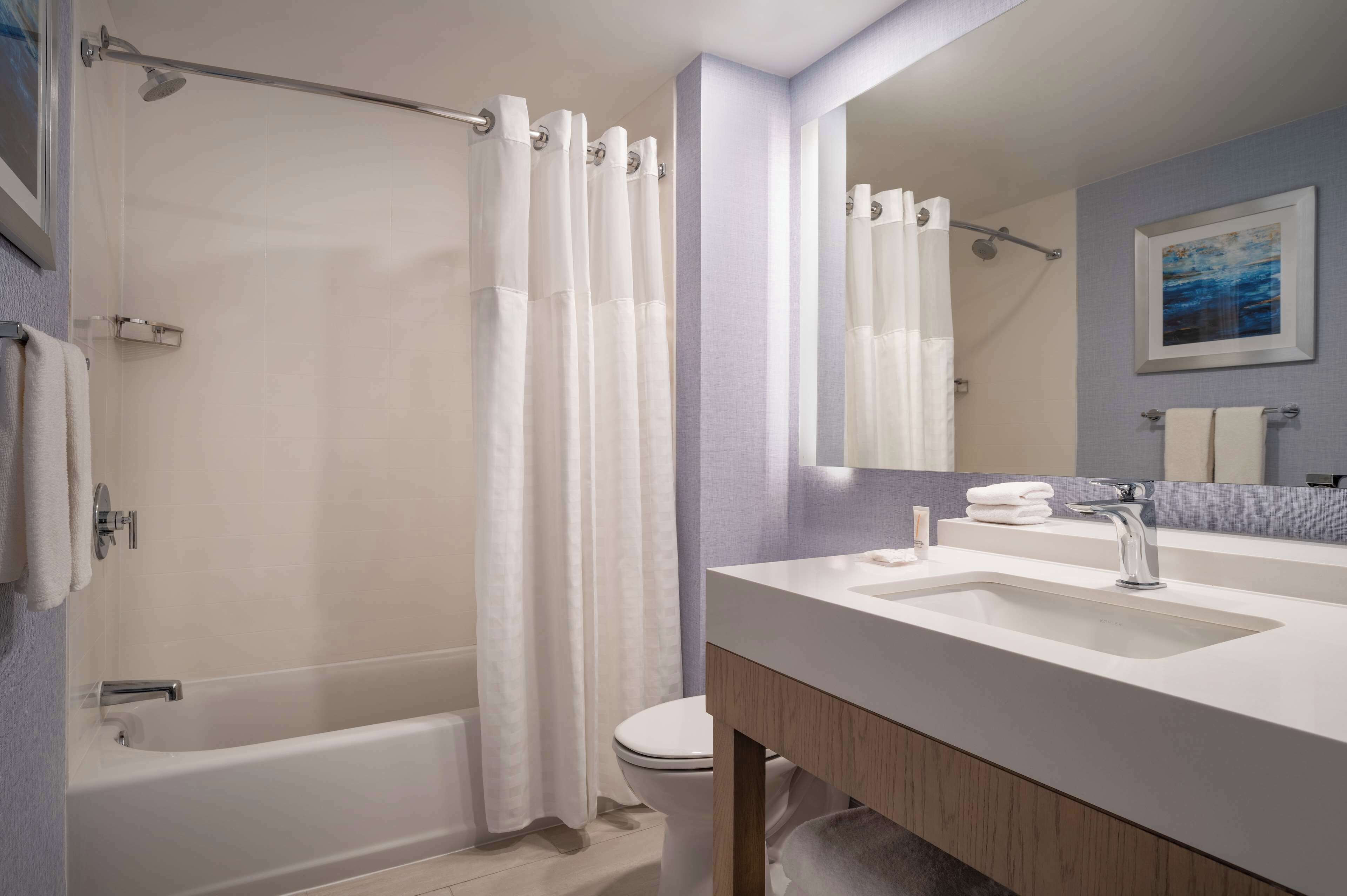 designer toiletries, hair dryer, towels