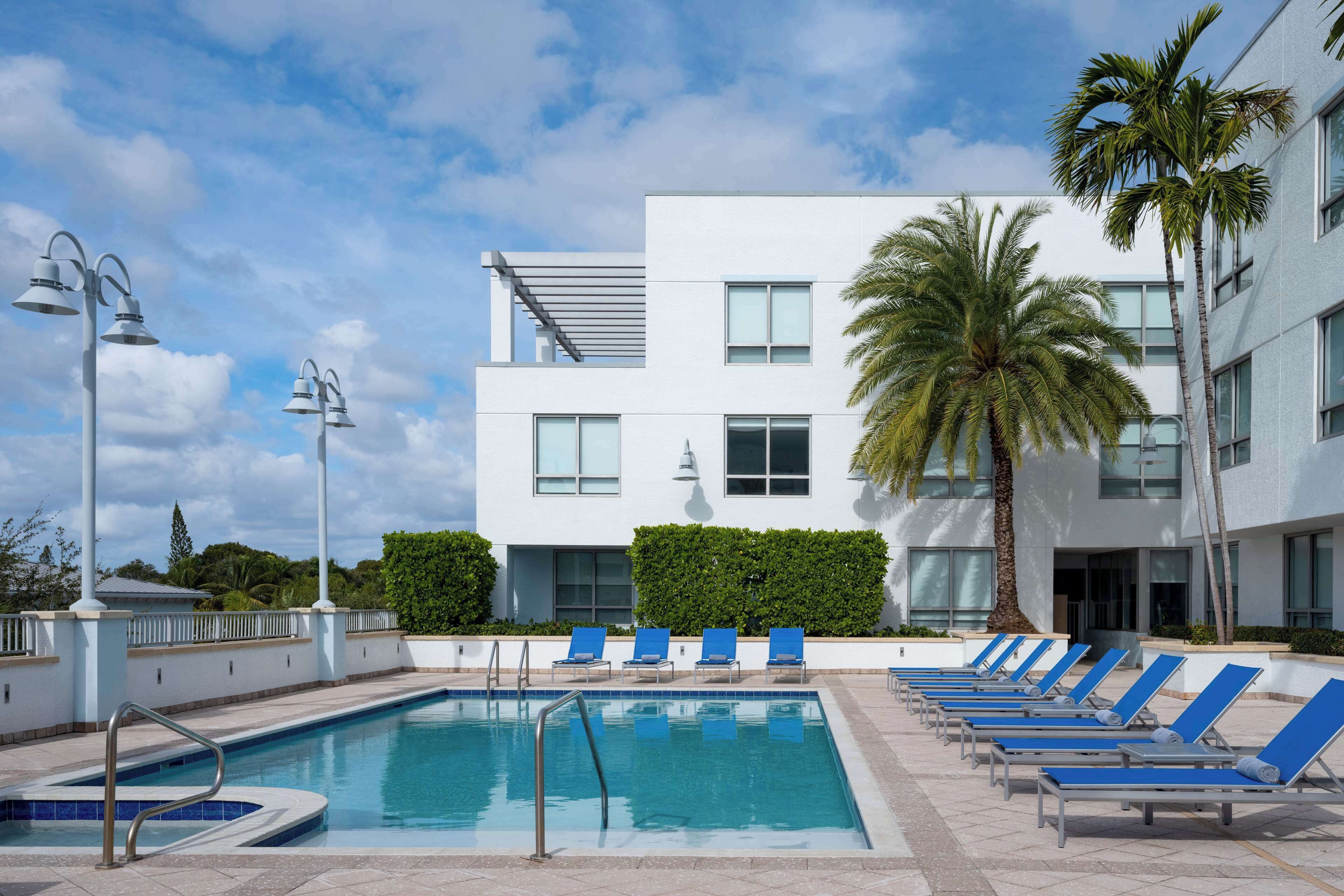 Outdoor pool, open 6:00 AM to 10:00 PM, pool umbrellas, pool loungers