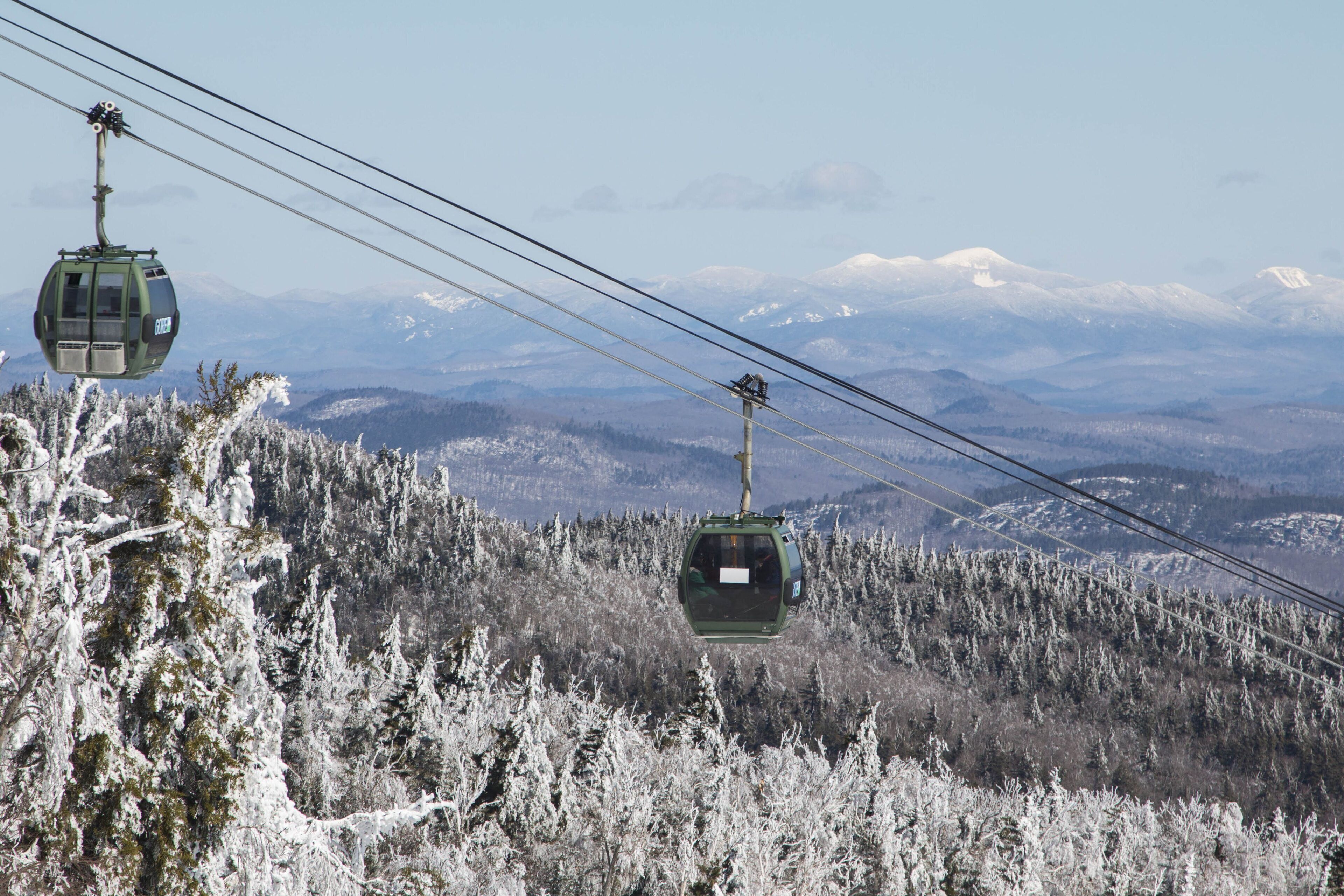 A cable car system in a snowy mountainous area.
