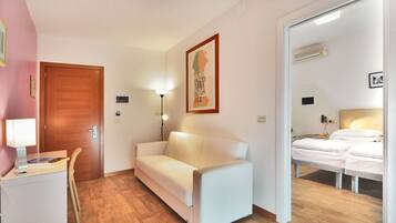 Family Room | Down duvets, minibar, in-room safe, desk