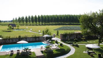 Indoor pool, outdoor pool, pool umbrellas, sun loungers