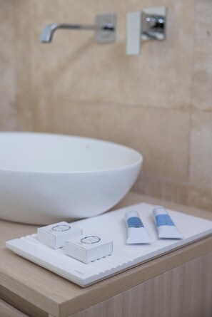 Shower, designer toiletries, hair dryer, bidet