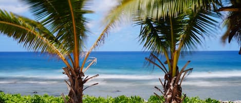 On the beach, surfing