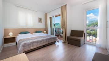 Twin Room, Balcony, Sea View | In-room safe, desk, iron/ironing board, bed sheets