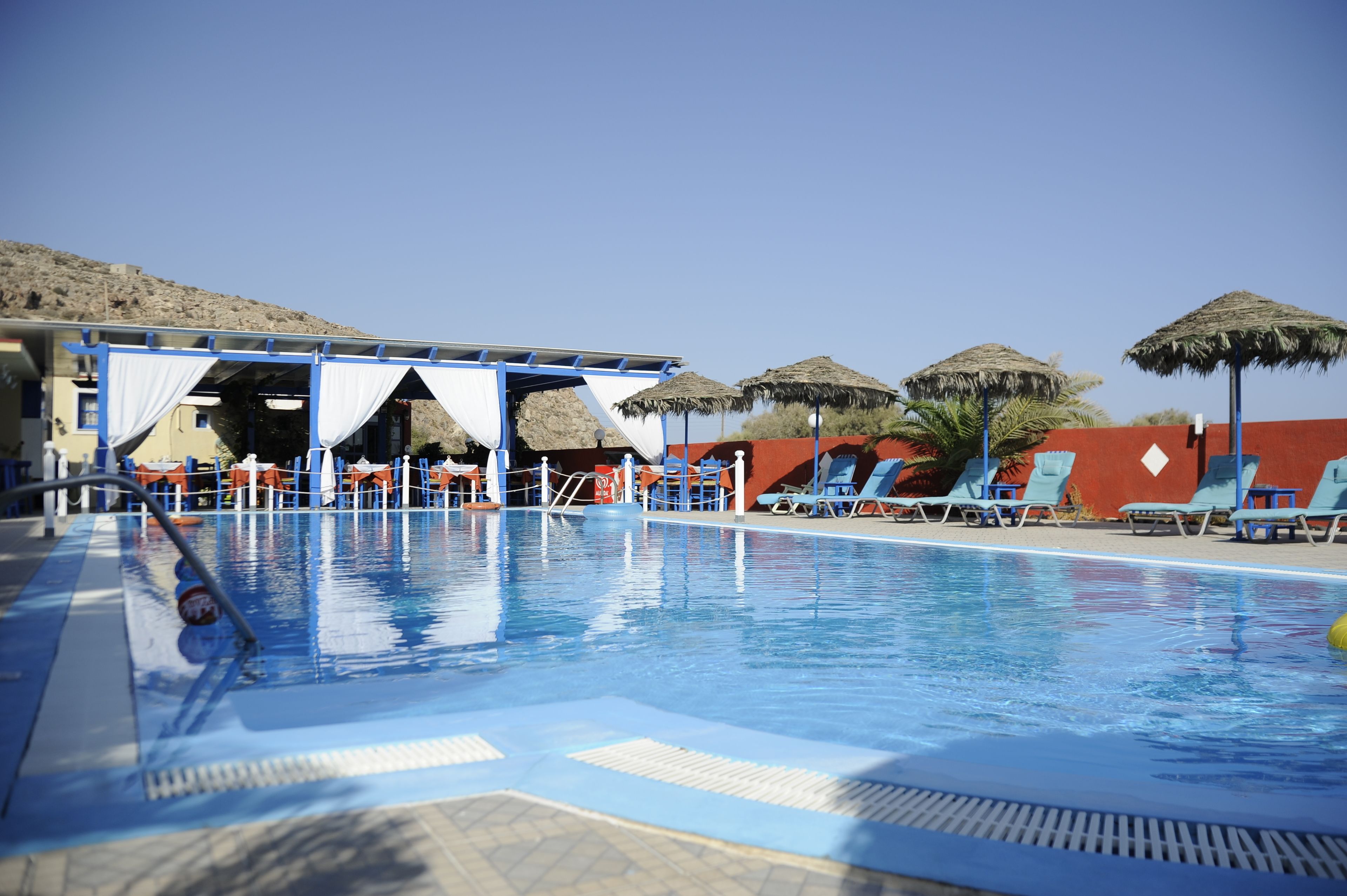 seasonal outdoor pool, open 8:00 am to 9:00 pm, pool umbrellas