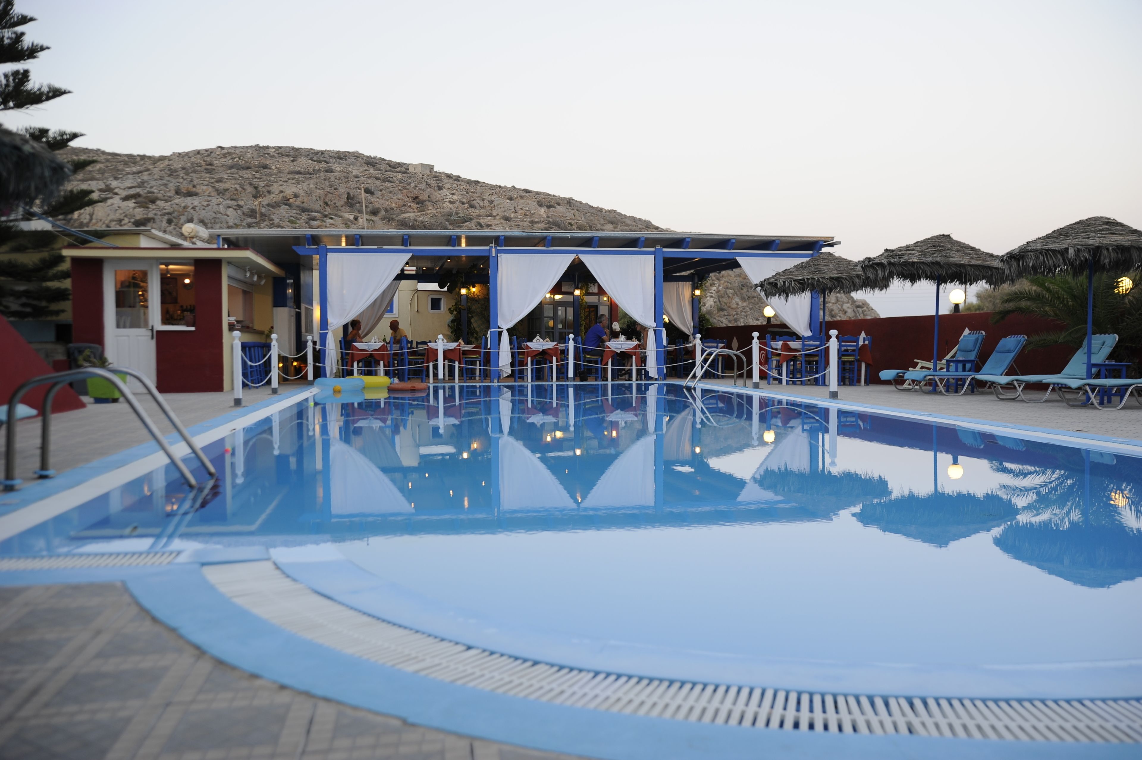 seasonal outdoor pool, open 8:00 am to 9:00 pm, pool umbrellas