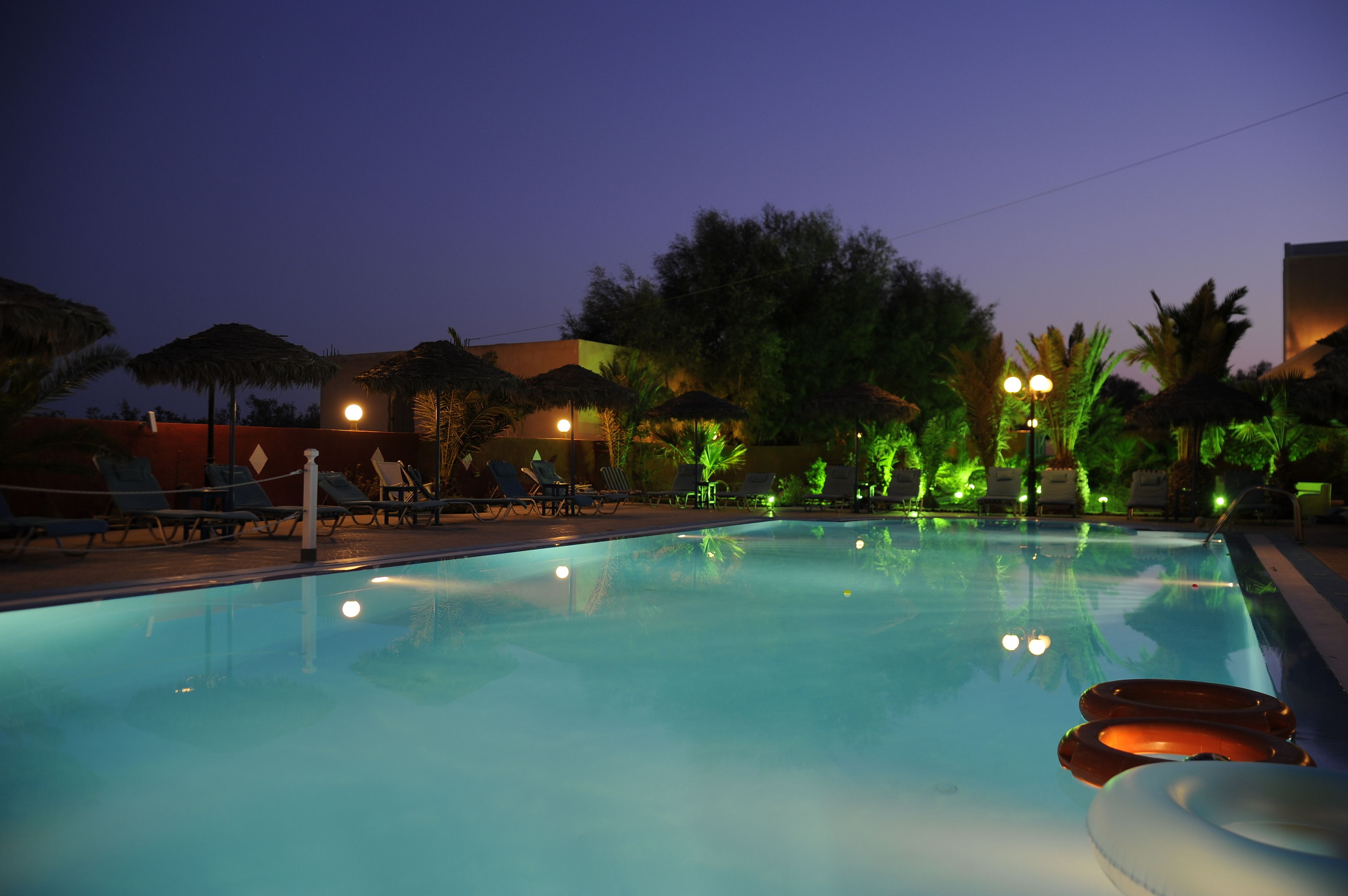 seasonal outdoor pool, open 8:00 am to 9:00 pm, pool umbrellas