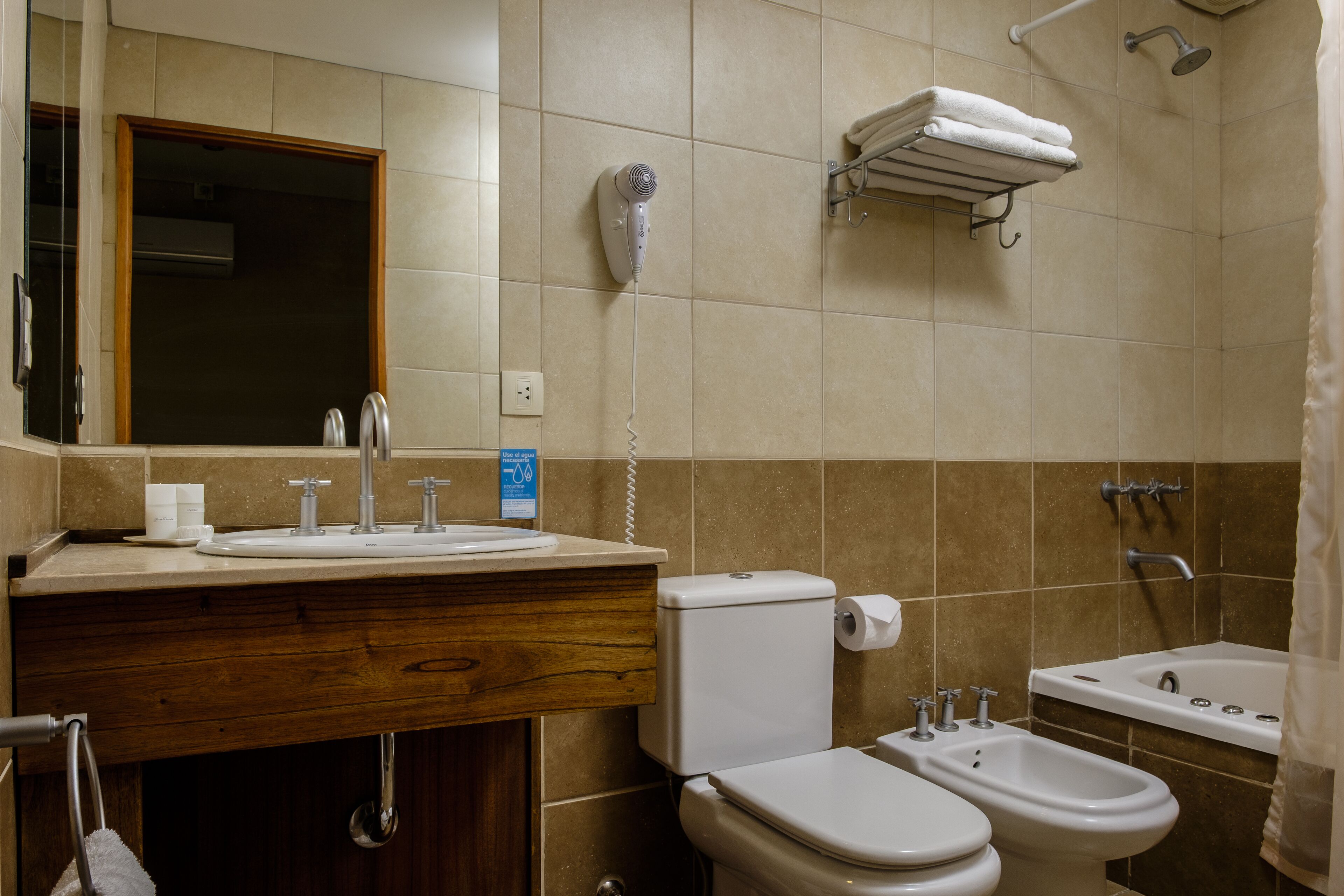 loft, partial lake view | bathroom | combined shower/bathtub, deep-soaking bathtub, rainfall showerhead