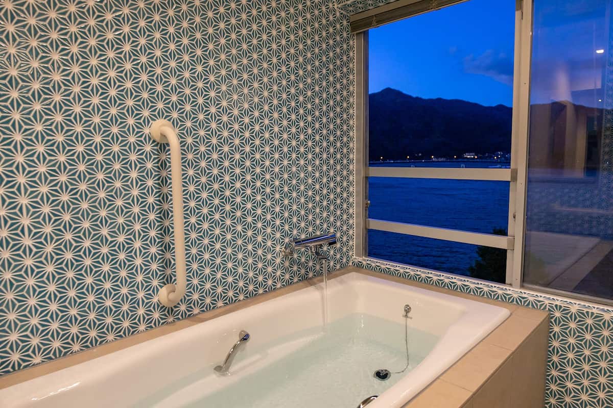 view bath corner room with tatami and lake view, non smoking | bathroom | free toiletries, hair dryer, slippers, electronic bidet