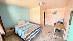 Deluxe Room, 1 Queen Bed, Refrigerator & Microwave, Ground Floor | Individually furnished, desk, blackout drapes, iron/ironing board