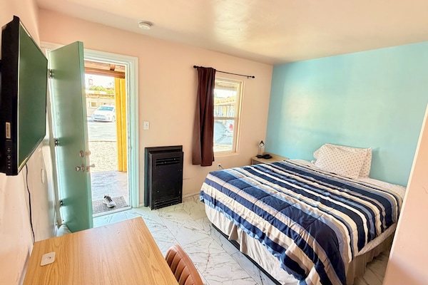 Deluxe Room, 1 Queen Bed, Refrigerator & Microwave, Ground Floor | Desk, blackout drapes, iron/ironing board (on request), WiFi (free)