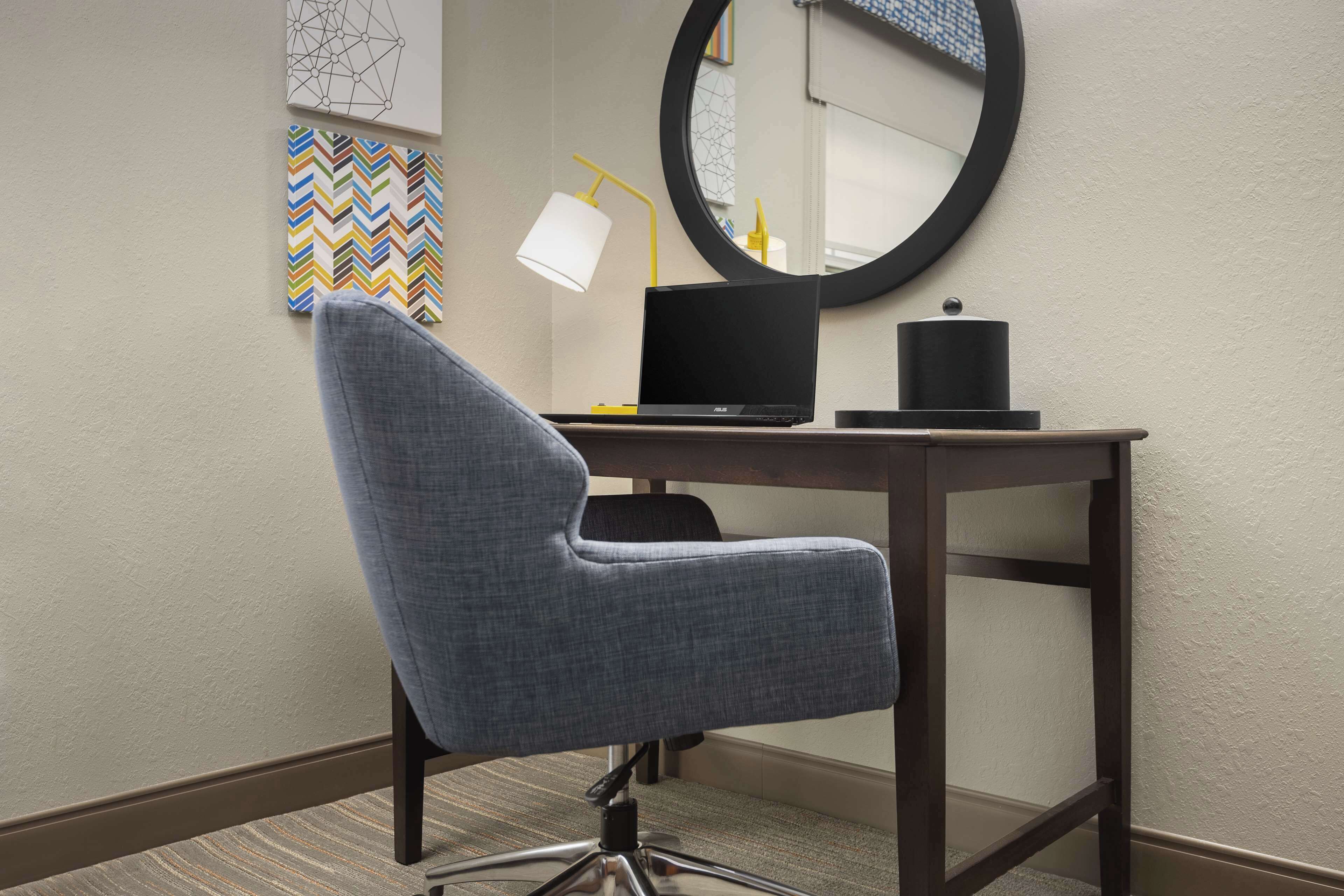 desk, laptop workspace, blackout curtains, iron/ironing board