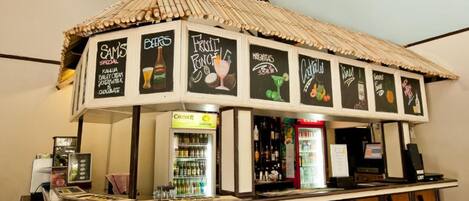A bar area with a menu board displaying options like 'Sam's Special' and 'Fruit Punch'.