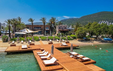 Private beach, free beach cabanas, sun-loungers, beach umbrellas. Casa dell'Arte Hotel of Arts & Leisure
