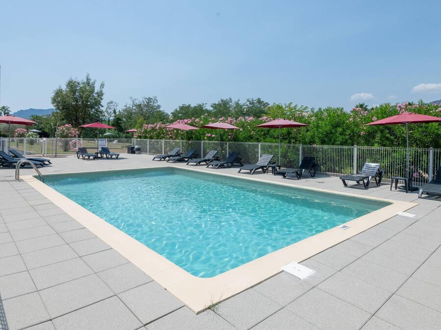 Seasonal outdoor pool, open 9:00 AM to 7:00 PM, pool umbrellas