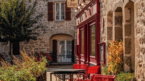 A stone building with a sign reading "Lois".