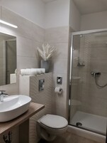 Shower, free toiletries, hair dryer, towels