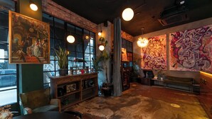 A cozy interior with a rustic wooden floor, a wooden bench, and a large window with a view. - SuB Karaköy - Special Class (Istanbul)