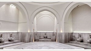 A spacious, modern bathroom with multiple sinks and a central decorative element. - SuB Karaköy - Special Class (Istanbul)
