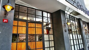 A modern building with large windows and a sign above the entrance. - SuB Karaköy - Special Class (Istanbul)